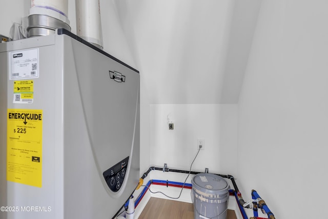 utility room featuring water heater