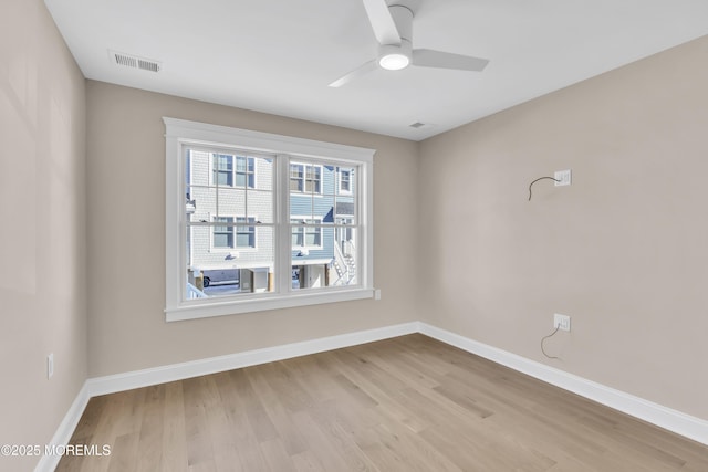 unfurnished room featuring ceiling fan and light wood-type flooring