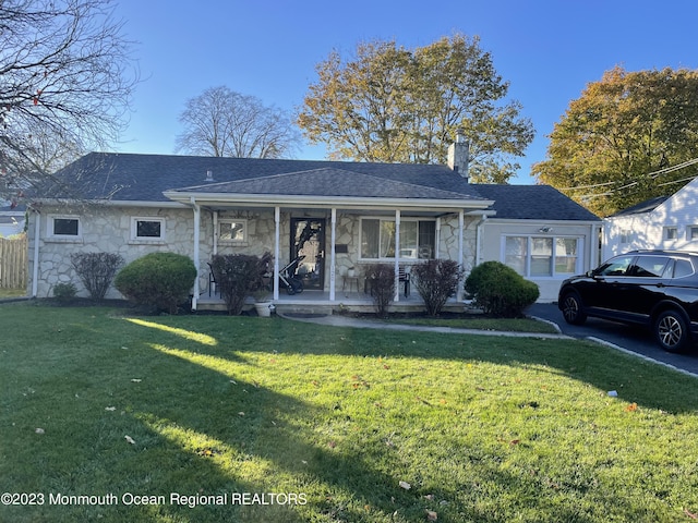 view of front of property with a porch and a front yard