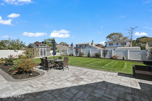 view of patio / terrace with a storage unit