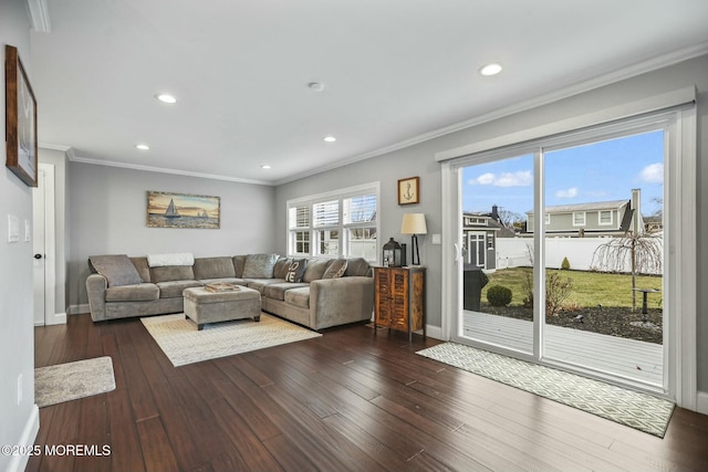 living room with dark hardwood / wood-style floors and ornamental molding