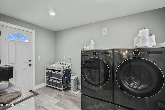 laundry area with washer and clothes dryer