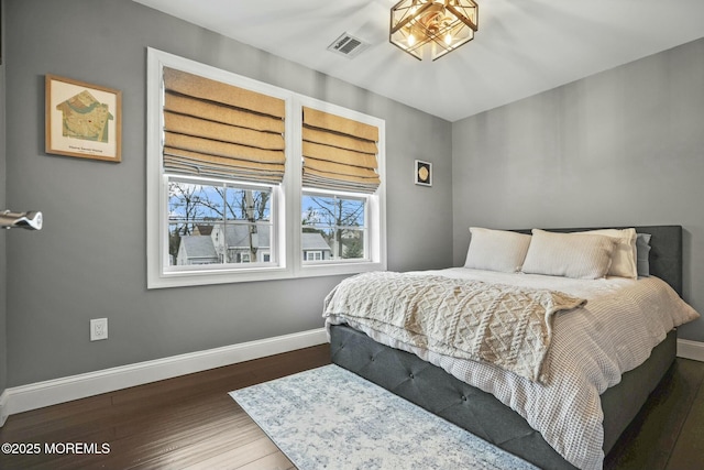 bedroom featuring dark hardwood / wood-style floors