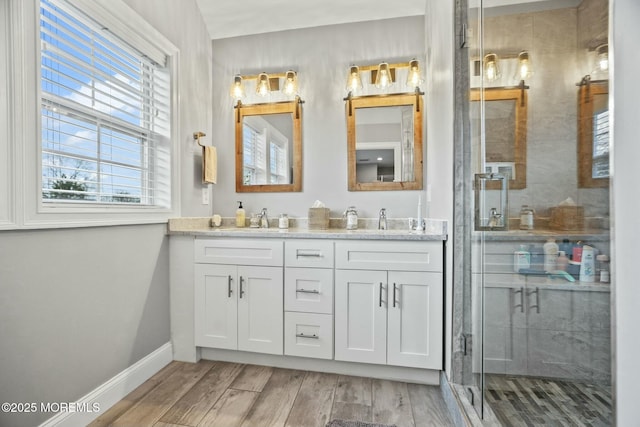 bathroom with vanity and an enclosed shower