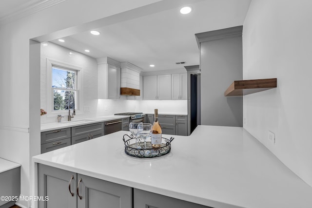 kitchen with gray cabinets and kitchen peninsula