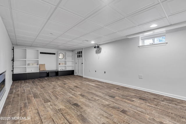 basement with hardwood / wood-style floors