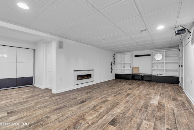 unfurnished living room featuring hardwood / wood-style floors