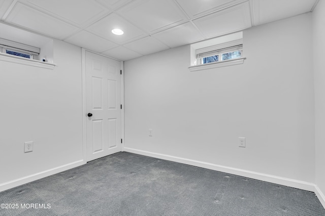 basement with dark colored carpet