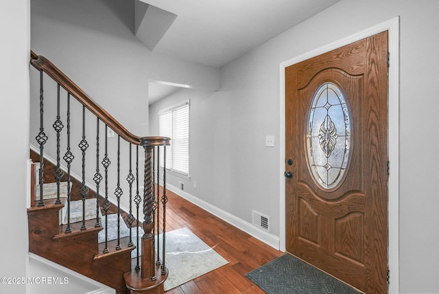 foyer entrance with hardwood / wood-style flooring