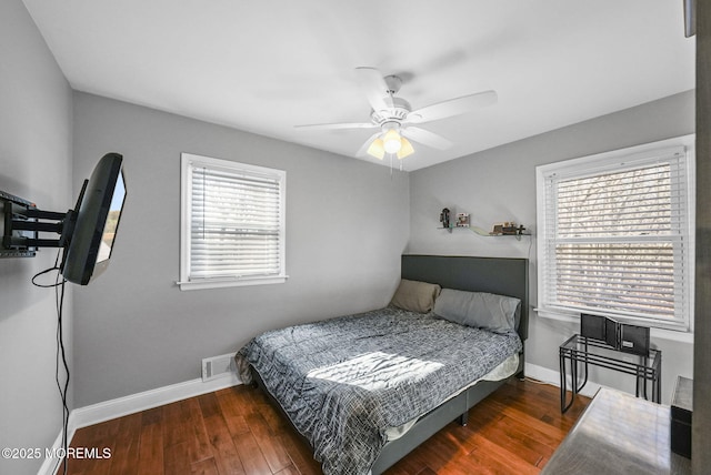 bedroom featuring ceiling fan and dark wood-type flooring