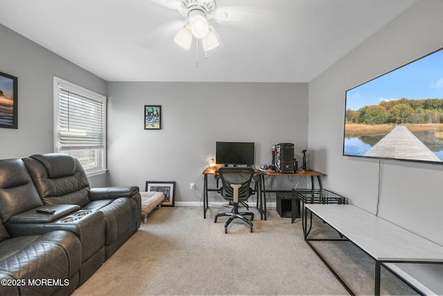 office featuring ceiling fan and light carpet