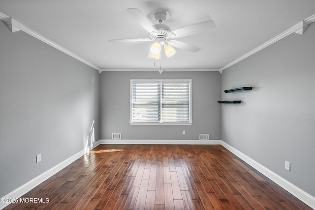 empty room featuring crown molding, dark hardwood / wood-style flooring, and ceiling fan