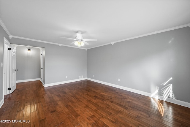 empty room featuring dark hardwood / wood-style flooring, ceiling fan, and crown molding