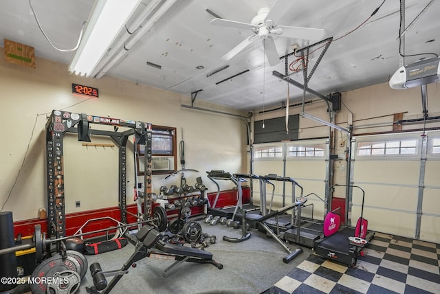 garage with a garage door opener, ceiling fan, and cooling unit