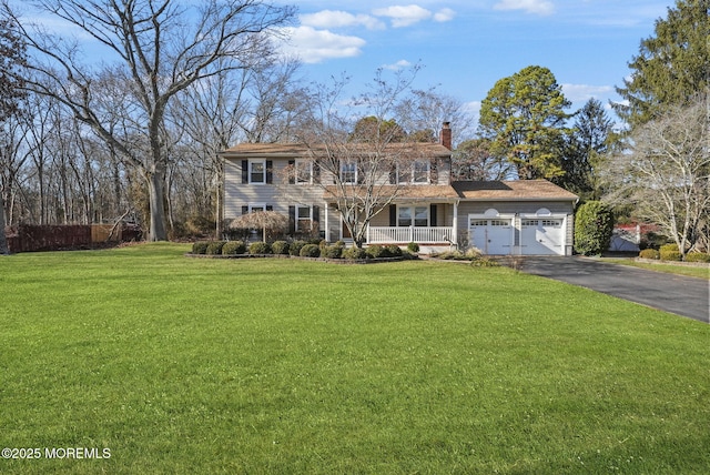 view of front of house featuring a garage and a front yard