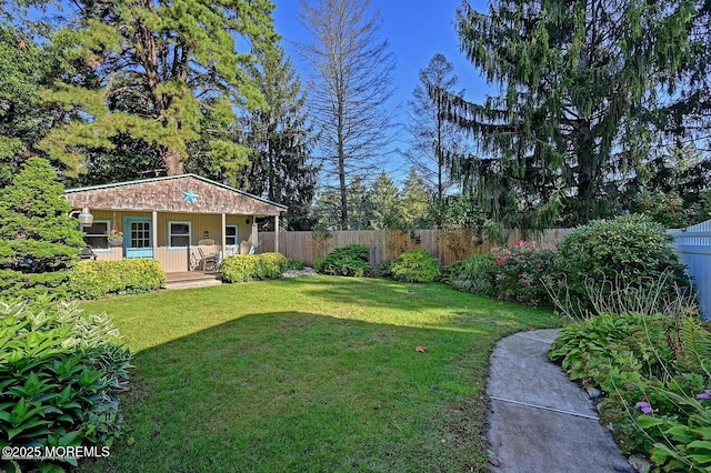 view of yard featuring covered porch