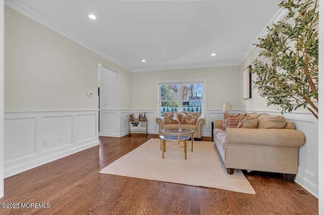 living room featuring dark hardwood / wood-style floors and crown molding