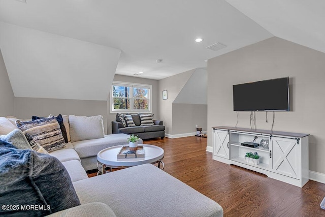 living room featuring dark hardwood / wood-style flooring and lofted ceiling