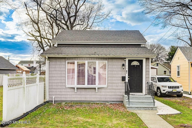 bungalow with a front lawn