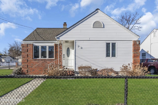 bungalow-style home featuring a front yard