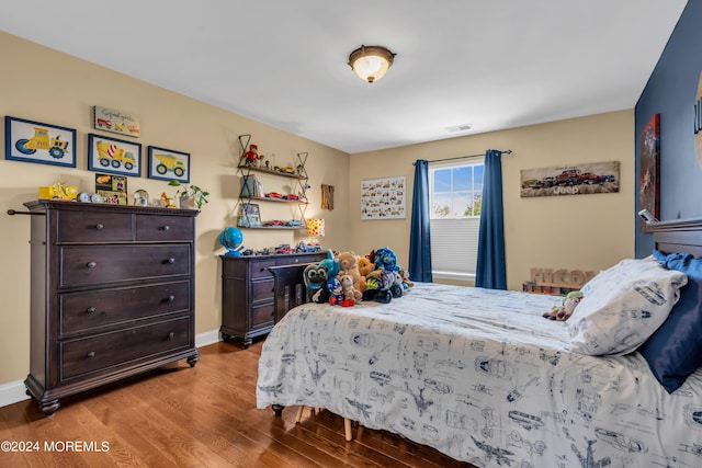 bedroom featuring hardwood / wood-style floors