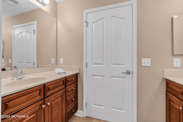 bathroom featuring tile patterned floors and vanity