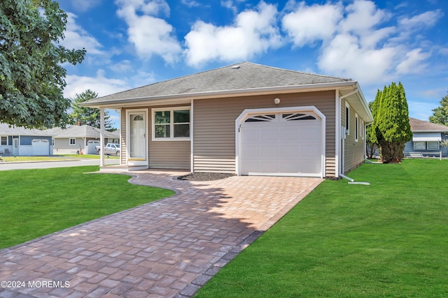 view of front of house featuring a front yard and a garage