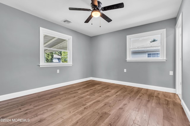 spare room with ceiling fan and light hardwood / wood-style flooring