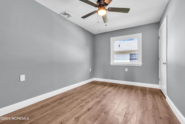 empty room featuring ceiling fan and light hardwood / wood-style floors