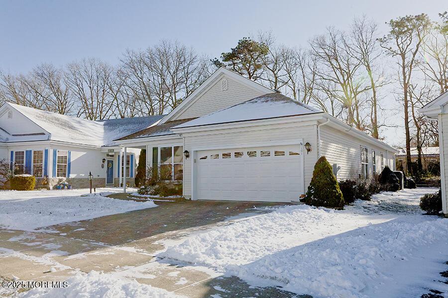 single story home with a garage