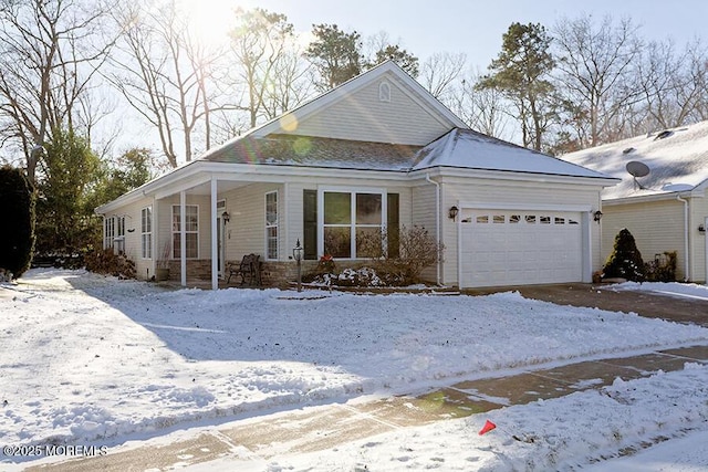 view of front of property featuring covered porch and a garage