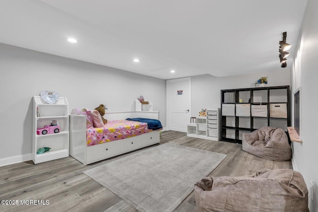 bedroom with hardwood / wood-style flooring