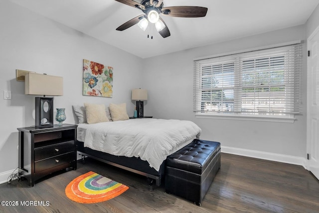 bedroom with dark hardwood / wood-style floors and ceiling fan