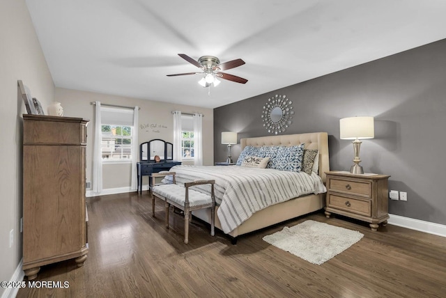 bedroom with dark wood-type flooring and ceiling fan