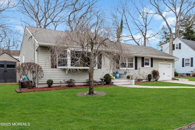 view of front of house with a front yard and a garage