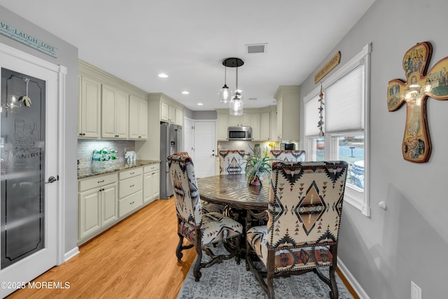 dining room with light hardwood / wood-style flooring