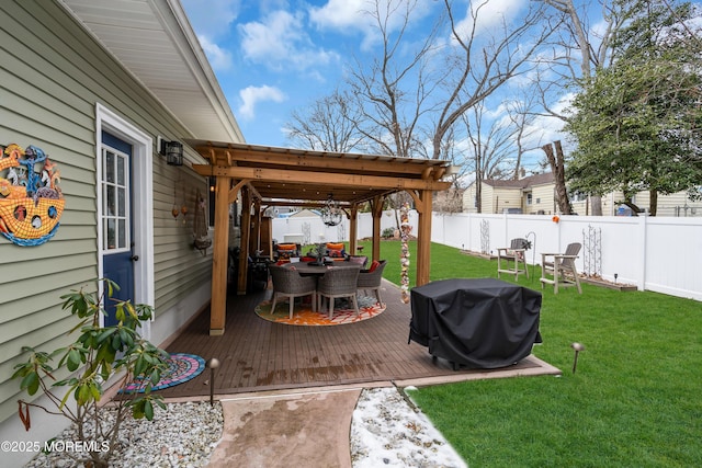 wooden terrace with area for grilling and a lawn