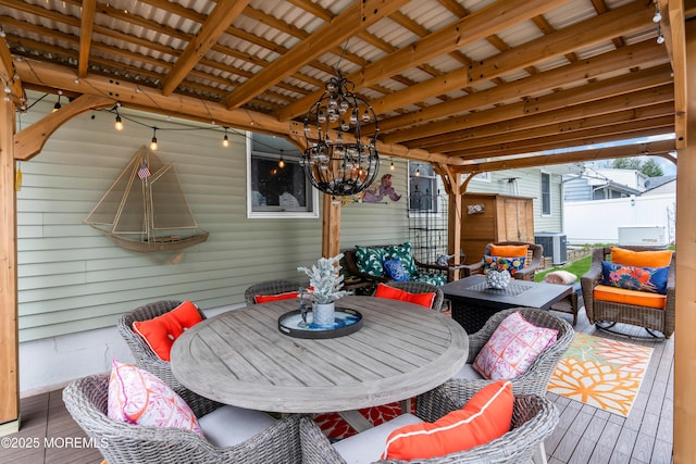 wooden deck with central air condition unit and an outdoor living space