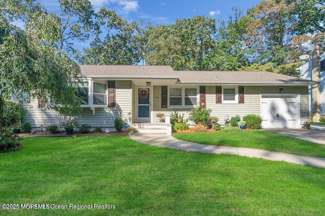 ranch-style house with a garage and a front lawn