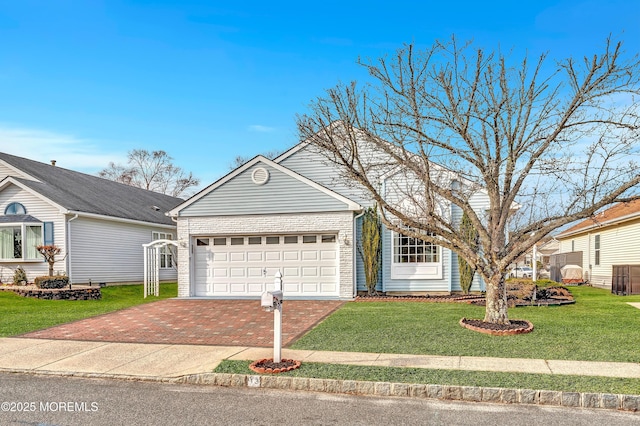 view of front of house with a front lawn and a garage