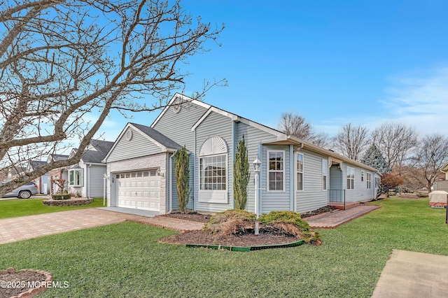 view of front of property with a garage and a front lawn