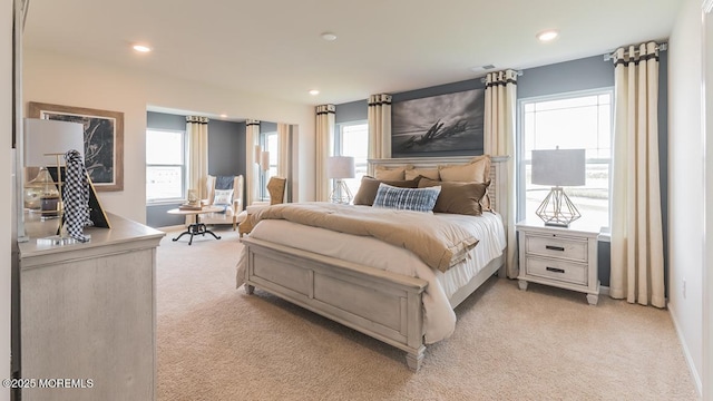 bedroom featuring light colored carpet