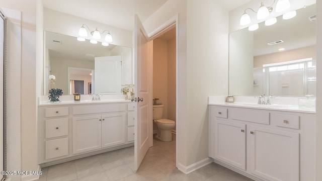 bathroom featuring tile patterned floors, vanity, and toilet