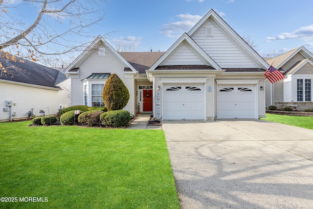 view of front of property featuring a front yard and a garage