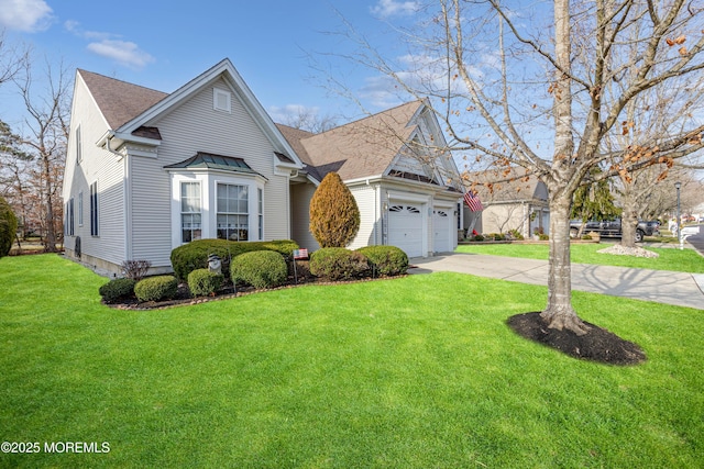 view of front of house featuring a front yard and a garage