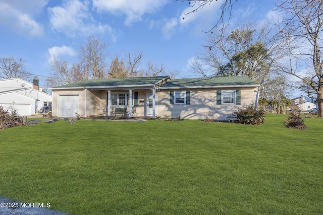 ranch-style home featuring a front lawn, covered porch, and a garage