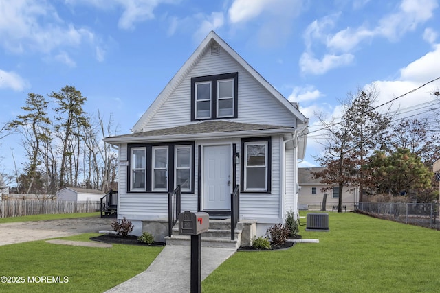 bungalow with central AC and a front lawn