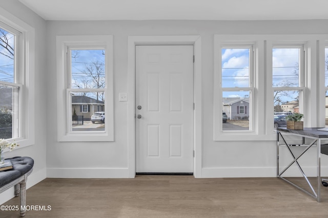 entryway with light hardwood / wood-style floors