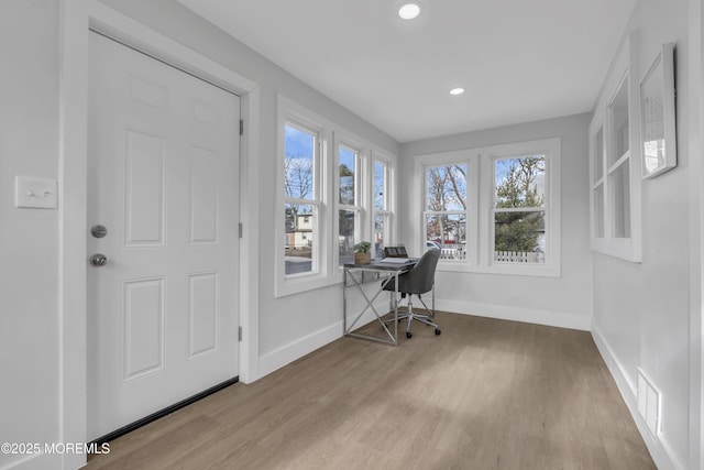 office with light hardwood / wood-style floors