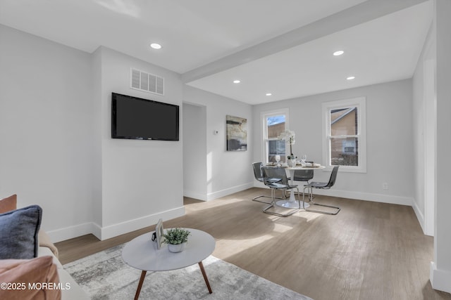 living room with light hardwood / wood-style flooring